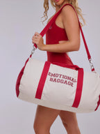 Person holding a duffel bag with 'EMOTIONAL BAGGAGE' text against a white background